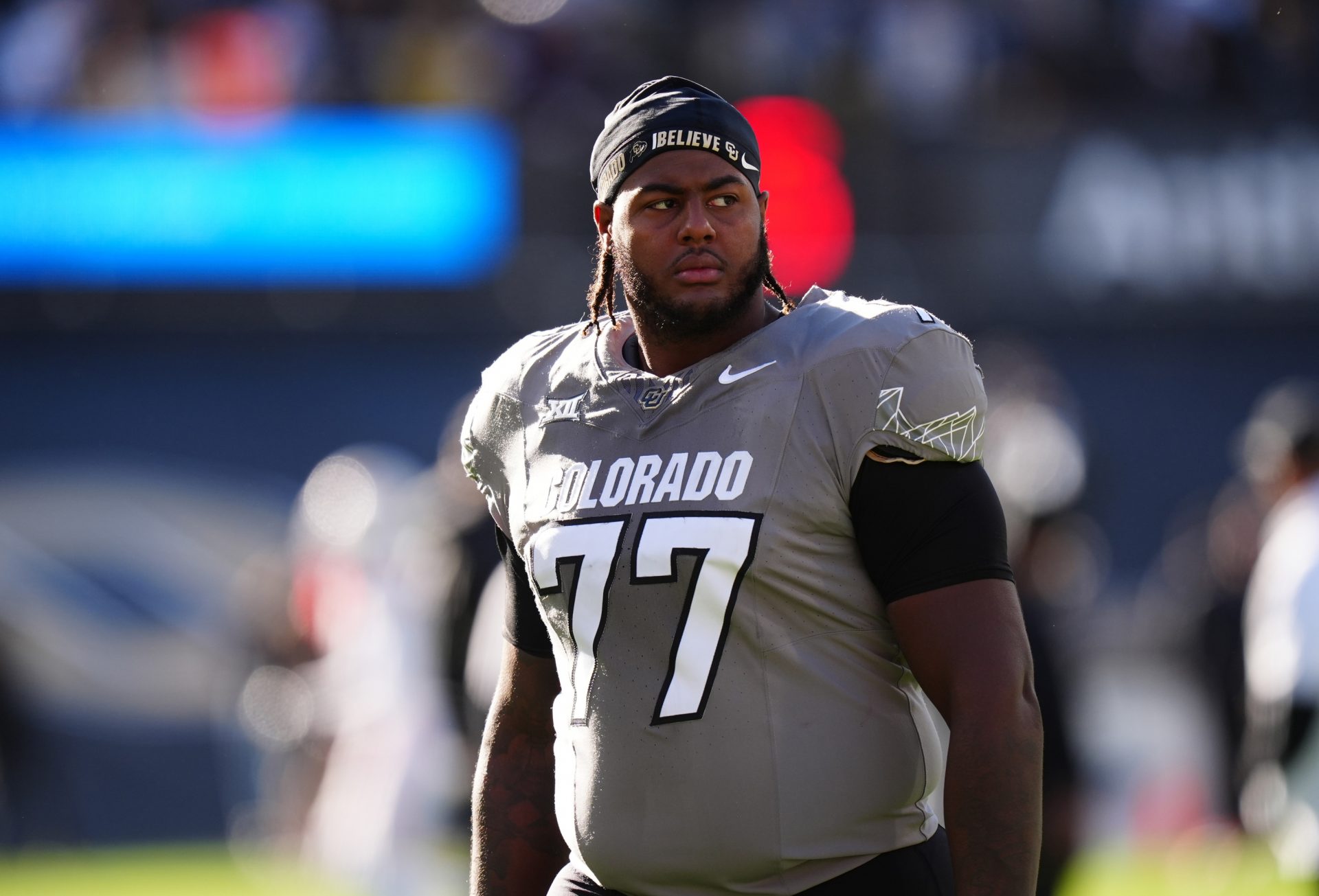 Colorado Buffaloes offensive tackle Jordan Seaton (77) looks on before the game against the Utah Utes at Folsom Field.