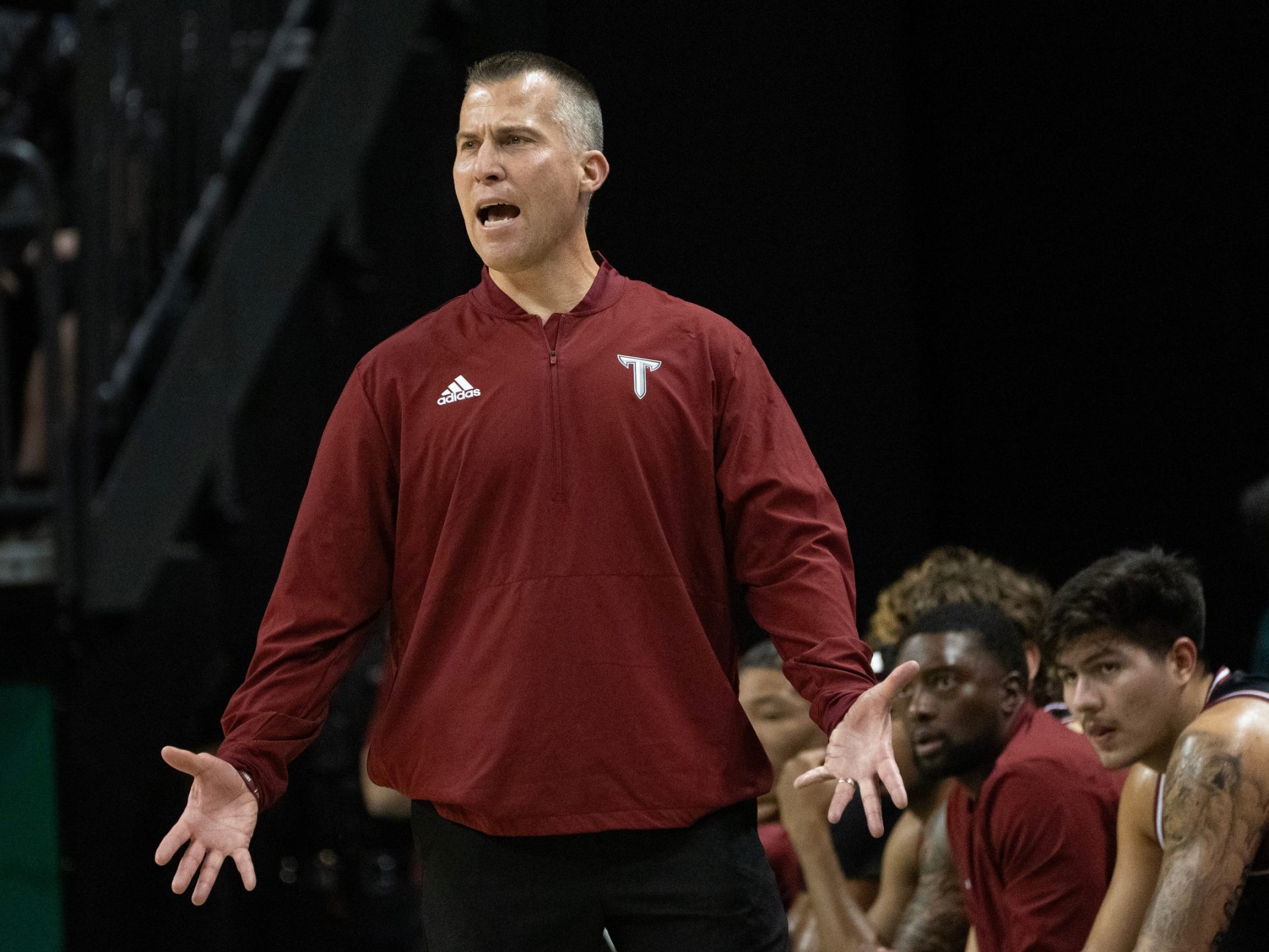 Troy coach Scott Cross calls to his team during the game against Oregon at Matthew Knight Arena in Eugene.