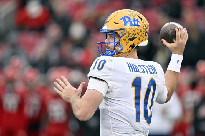 Pittsburgh Panthers quarterback Eli Holstein (10) throws against the Louisville Cardinals during the first quarter at L&N Federal Credit Union Stadium.