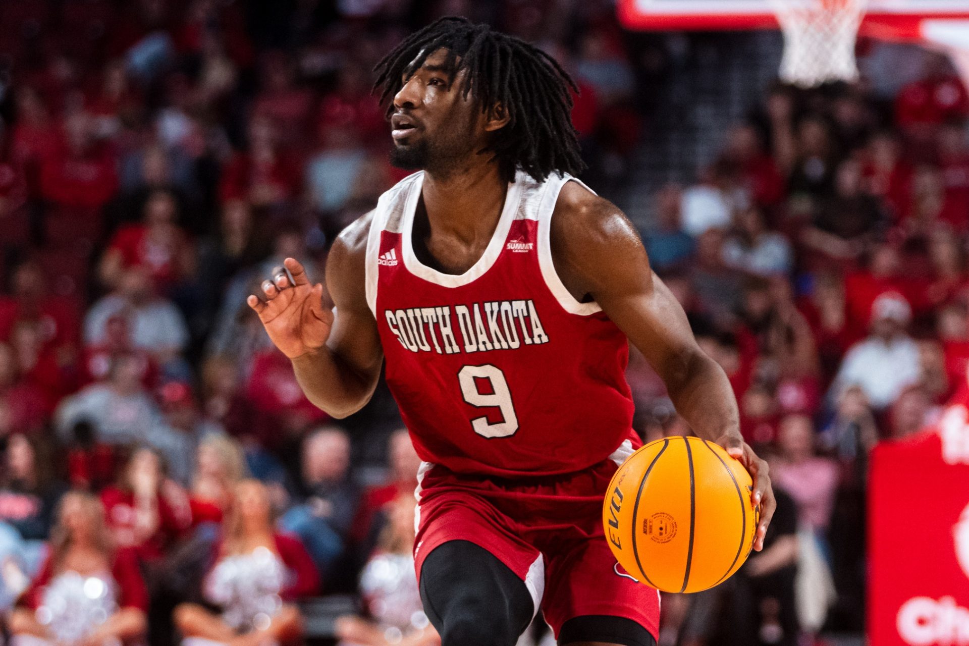 South Dakota Coyotes guard Chase Forte (9) dribbles during the second half against the Nebraska Cornhuskers at Pinnacle Bank Arena.