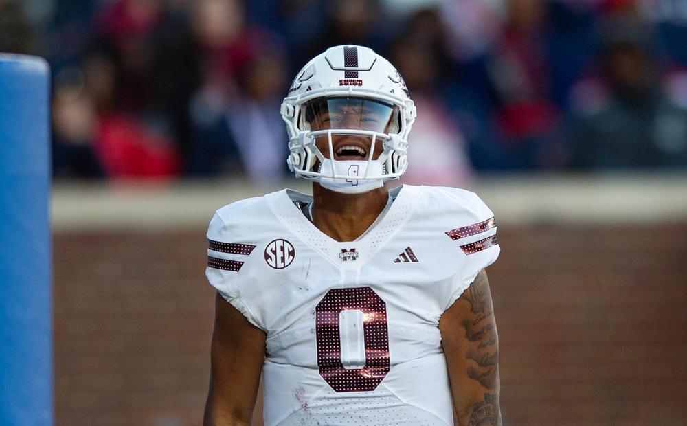 Mississippi State's quarterback Michael Van Buren Jr. (0) celebrates scoring a touchdown during the Egg Bowl game against Mississippi at Vaught-Hemingway Stadium on Friday, Nov. 29, 2024.