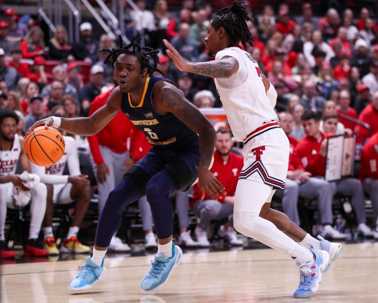 Northern Colorado's Langston Reynolds is defended by Texas Tech's Elijah Hawkins during a non-conference