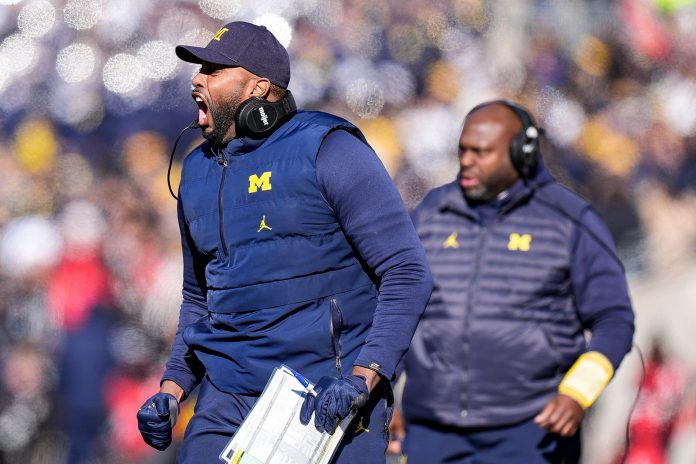 Michigan head coach Sherrone Moore reacts to a play against Ohio State