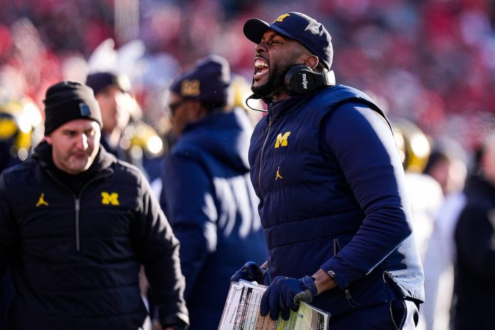 Michigan head coach Sherrone Moore celebrates a play against Ohio State during the second half at Ohio Stadium in Columbus, Ohio on Saturday, Nov. 30, 2024.