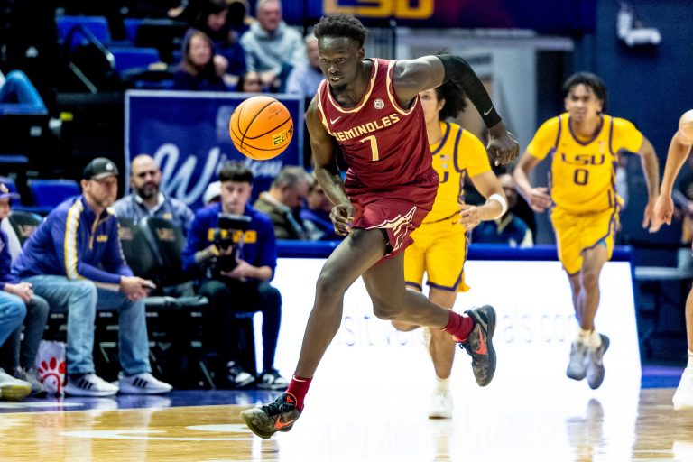 Florida State Seminoles forward Jerry Deng (7) brings the ball up court against the LSU Tigers during the second half at Pete Maravich Assembly Center.