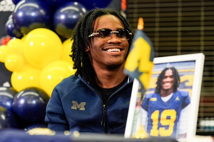 Michigan signee Bryce Underwood smiles during national signing day