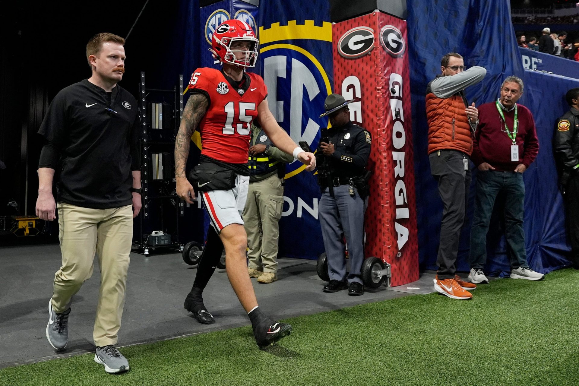 Georgia quarterback Carson Beck (15) takes the field to warm up before the start of the SEC championship game against Texas