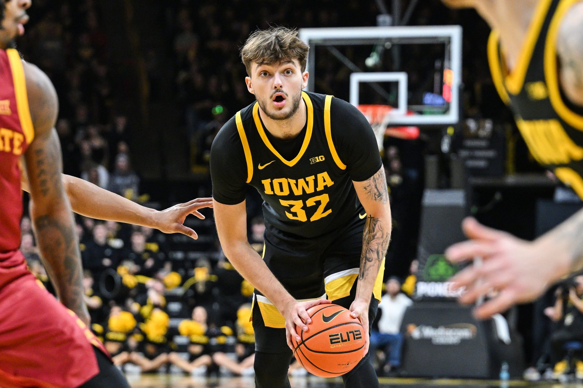 Iowa Hawkeyes forward Owen Freeman (32) looks to pass the ball against the Iowa State Cyclones during the second half at Carver-Hawkeye Arena.