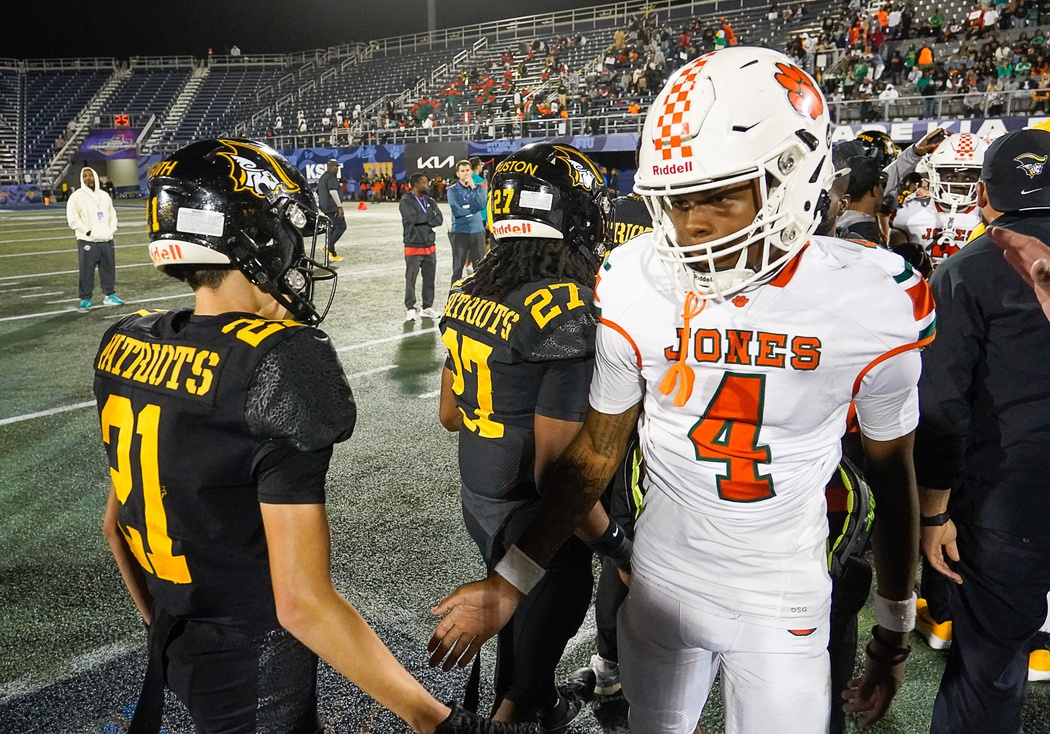 Jones Tigers quarterback (4) Dereon Coleman congratulates American Heritage Patriots players after the FHSAA Class 4A Football Championship on Friday, December 13, 2024 in Miami, Florida.