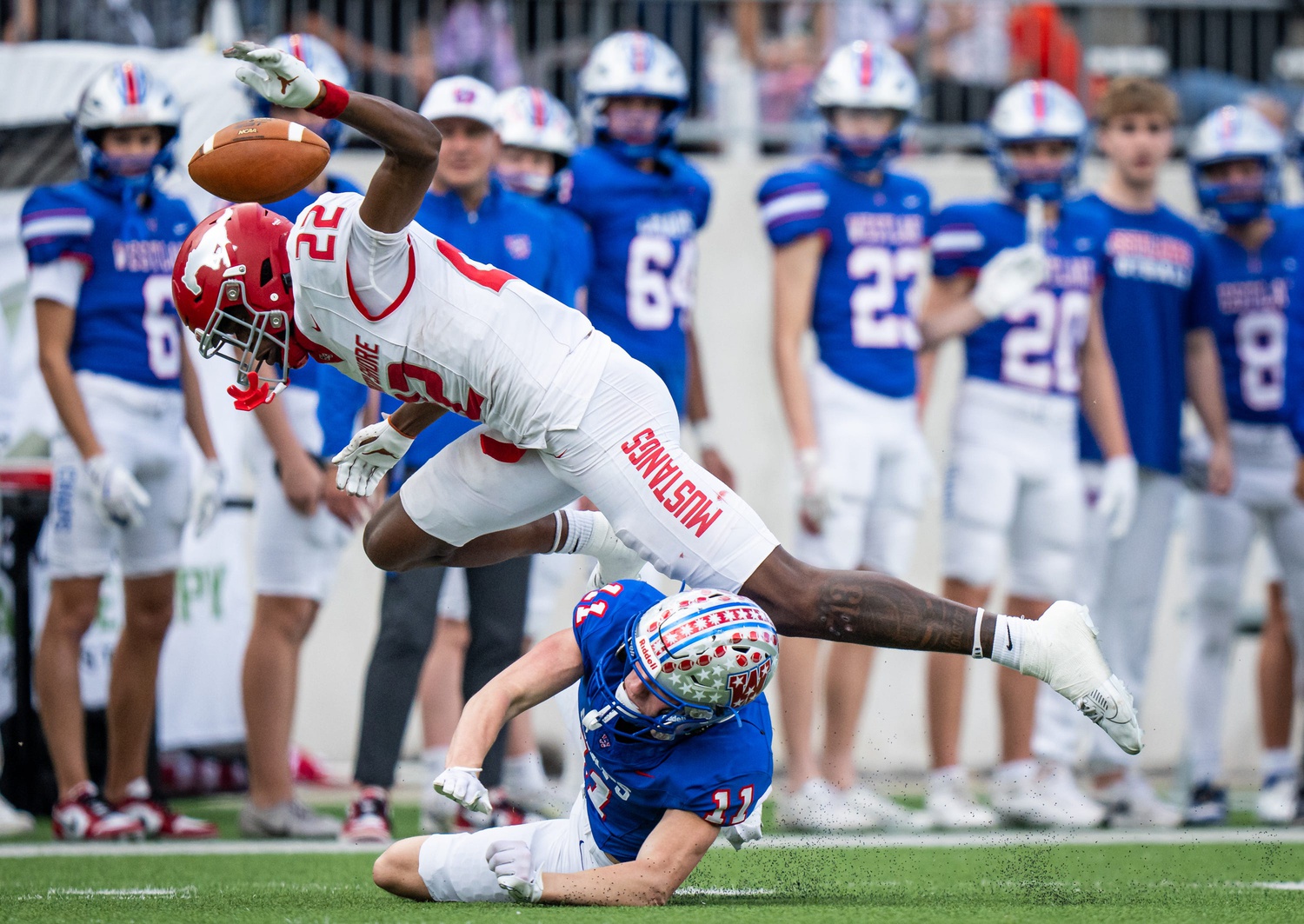 Westlake Chaparrals wide receiver Chase Bowen (11) and North Shore Mustangs free safety Chace Calicut (22) collide after the punt bounces in the first quarter as the Chaparrals take on the Mustangs in the Conference 6A Division 1 UIL State Playoff semi-final game at Legacy Stadium in Katy, Dec. 14, 2024.