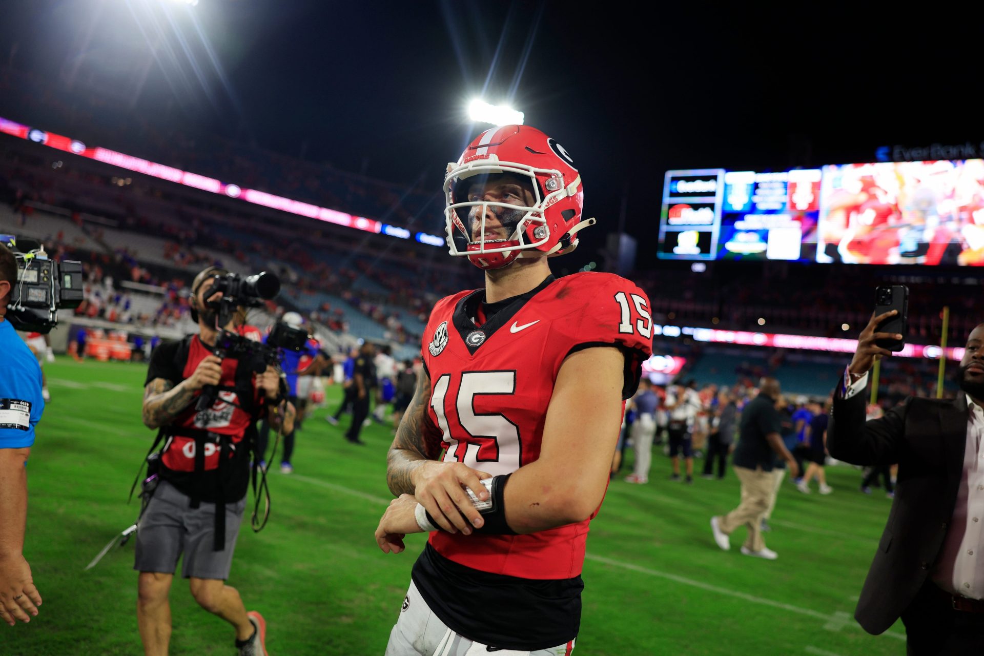 Georgia Bulldogs quarterback Carson Beck (15) walks off the field