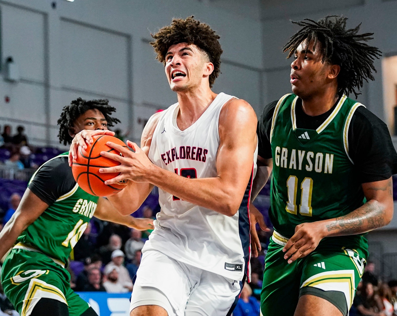 Columbus Explorers forward Cameron Boozer (12) drives to the basket as Grayson Rams forward Amir Taylor (11) guards him during the third quarter of a City of Palms Classic quarterfinal game at Suncoast Credit Union Arena in Fort Myers, Fla., on Friday, Dec. 20, 2024.