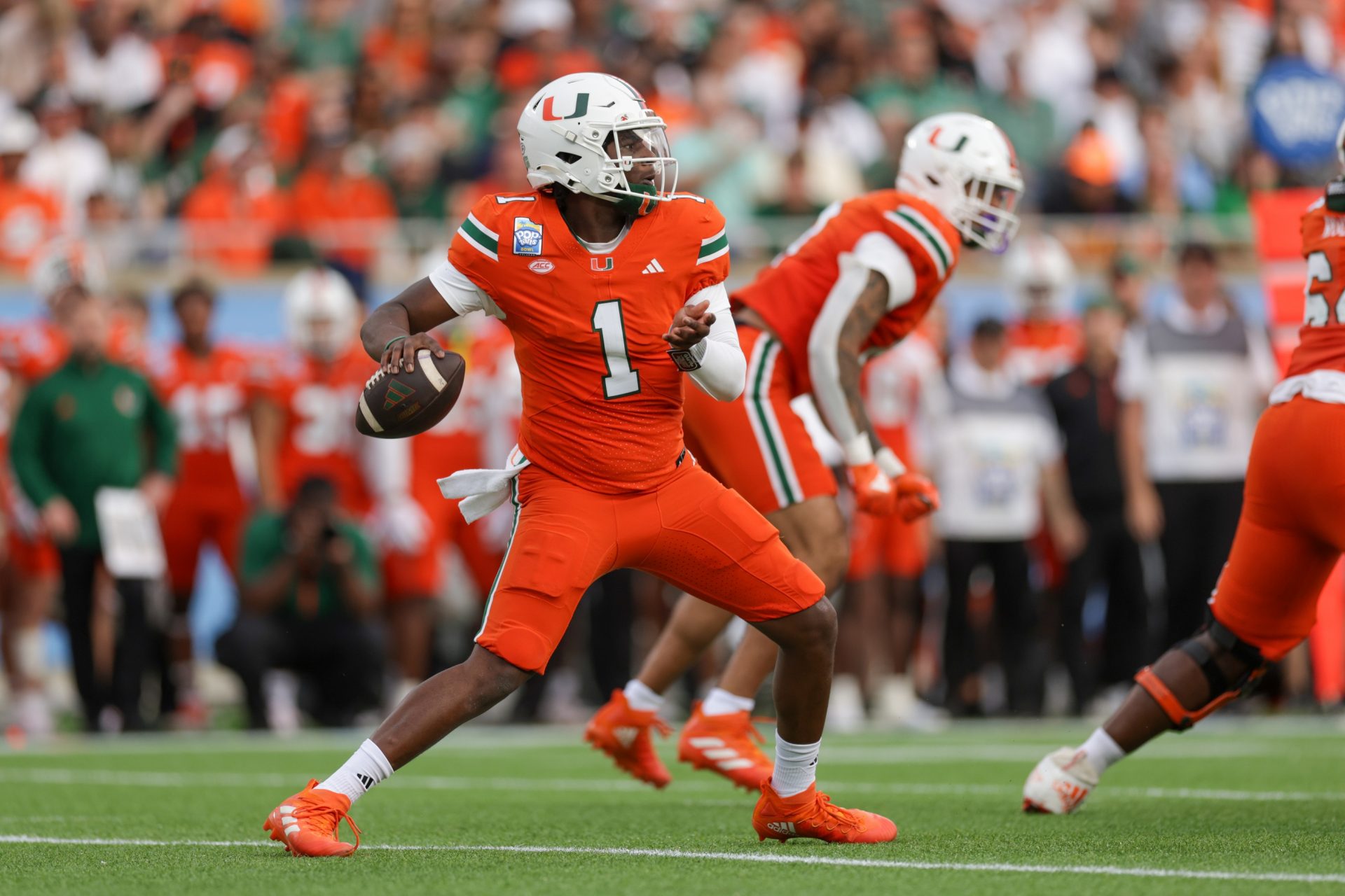 Miami Hurricanes quarterback Cam Ward (1) drops back to pass against the Iowa State Cyclones in the first quarter during the Pop Tarts bowl at Camping World Stadium