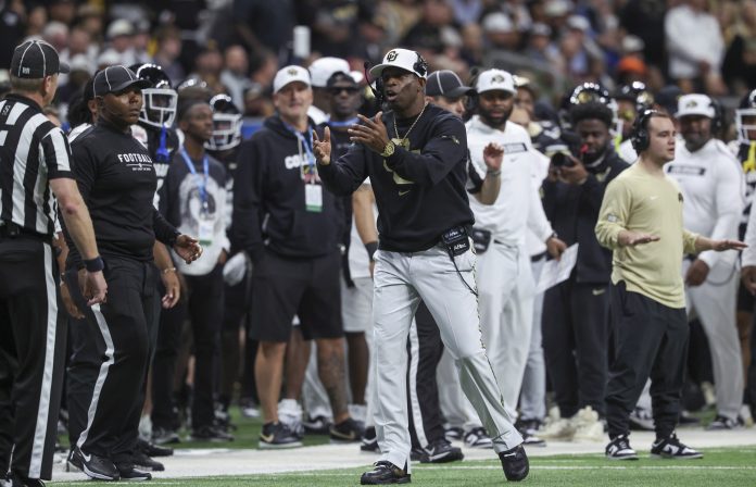 Colorado Buffaloes head coach Deion Sanders reacts on the sideline after a play during the second quarter against the Brigham Young Cougars at Alamodome.