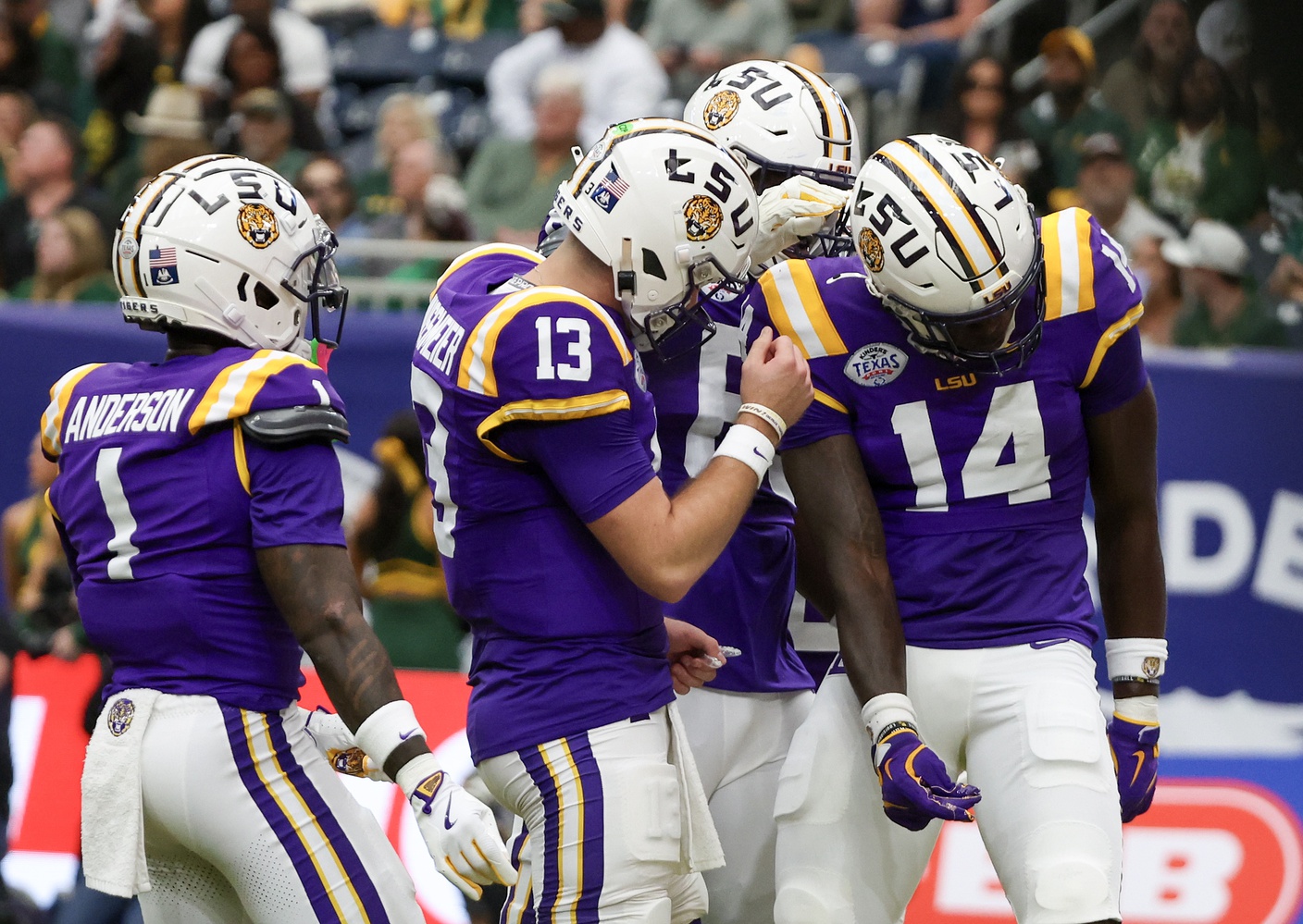 LSU Tigers quarterback Garrett Nussmeier (13) celebrates tight end Trey'Dez Green (14) touchdown reception against the Baylor Bears