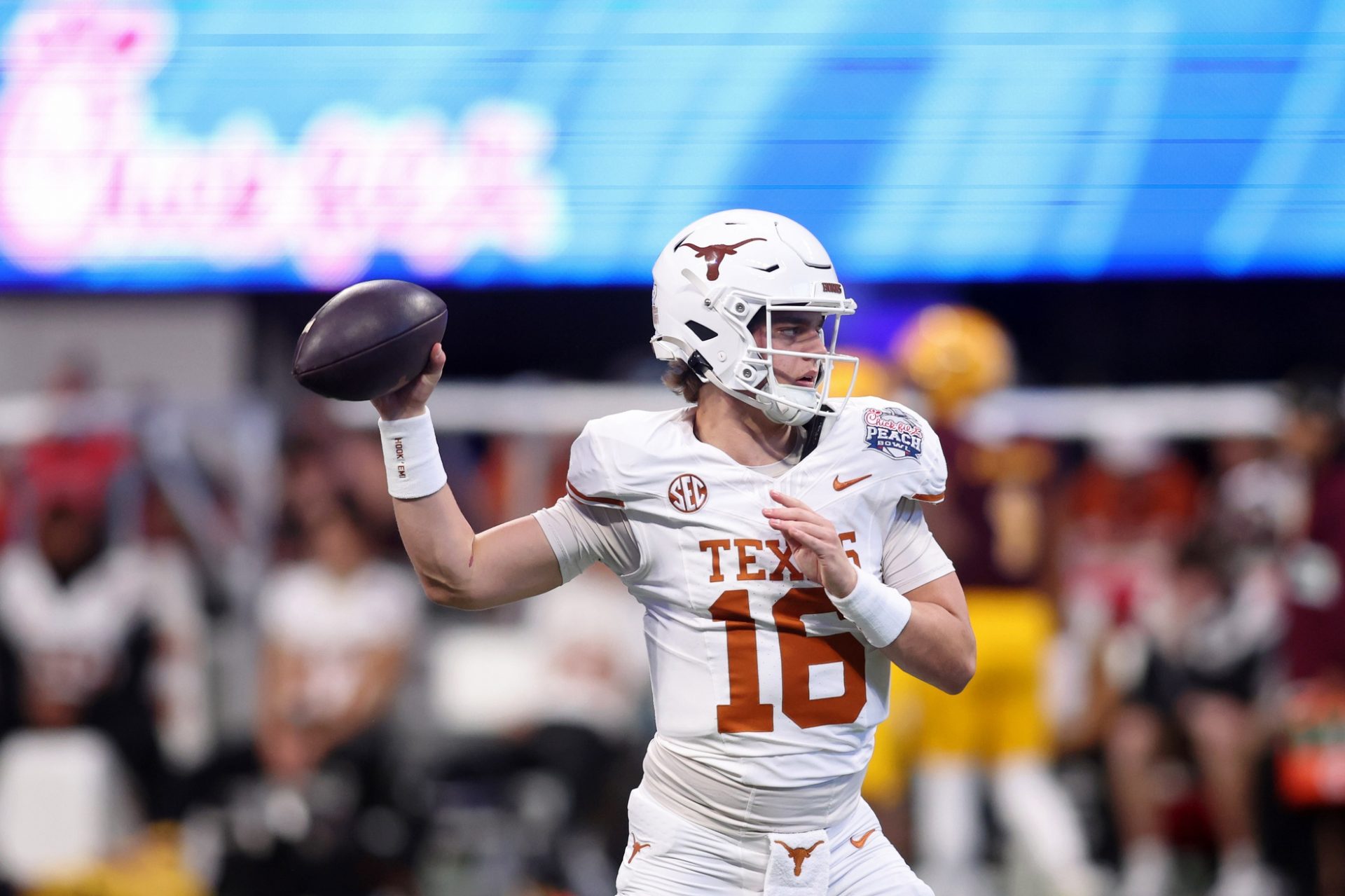 Texas Longhorns quarterback Arch Manning (16) warms up before the Peach Bowl at Mercedes-Benz Stadium.