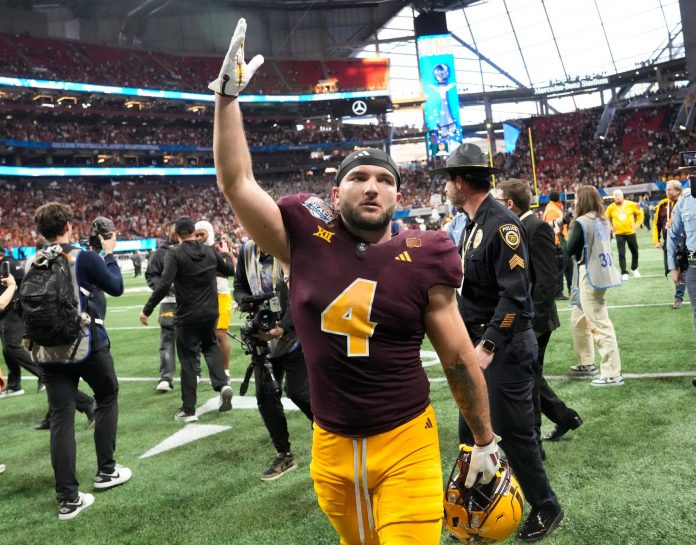 Arizona State running back Cam Skattebo (4) blows a kiss toward the fans after Texas won 39-31 over Arizona State in double overtime in the Chick-fil-A Peach Bowl in Atlanta on Wednesday, Jan. 1, 2025.