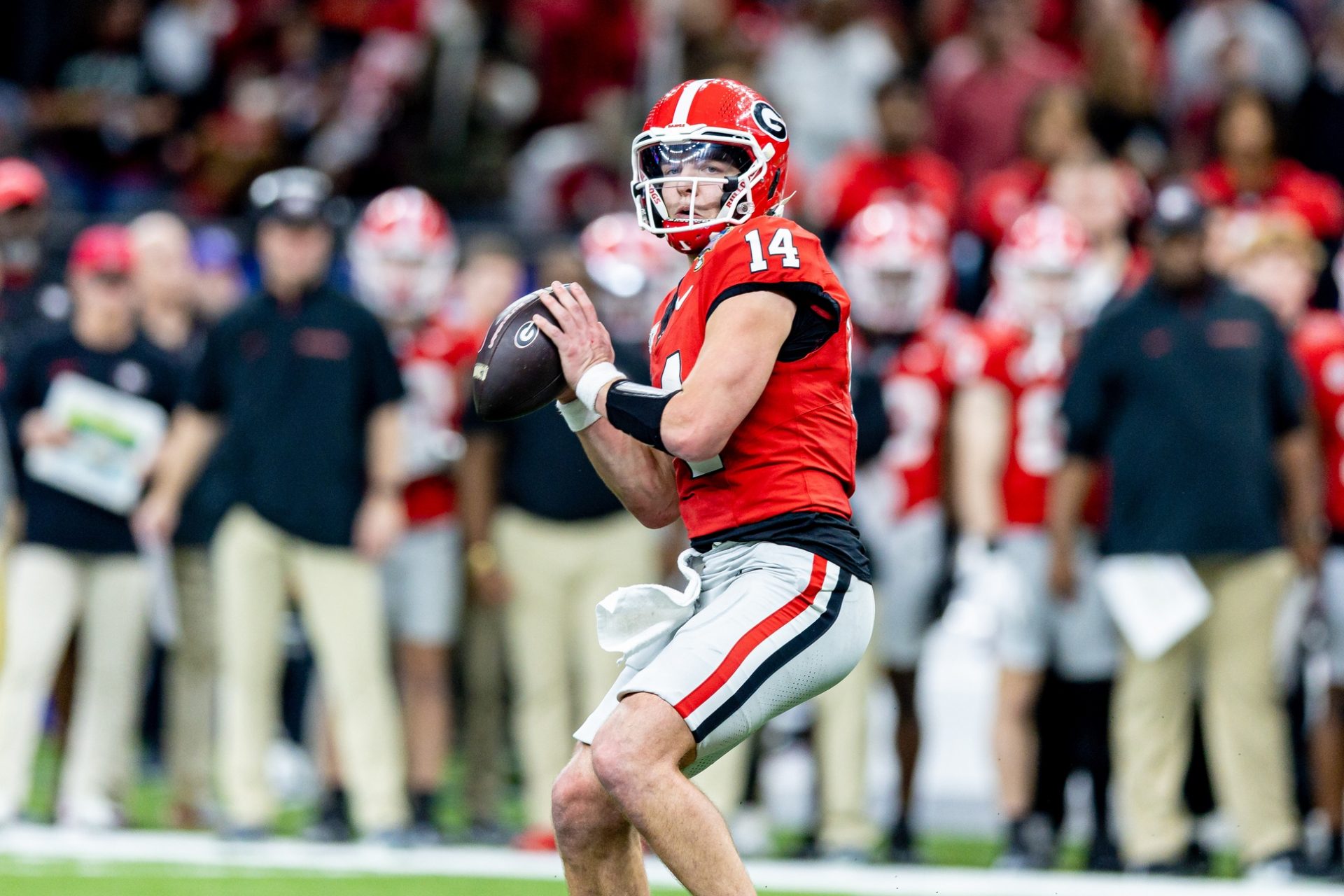 Georgia Bulldogs quarterback Gunner Stockton (14) drops back to pass against against the Notre Dame Fighting Irish