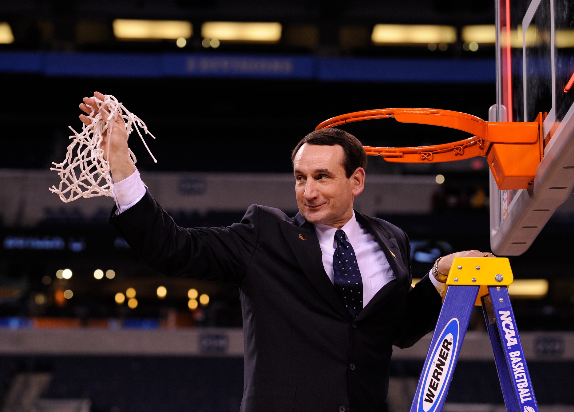 Duke head coach Mike Krzyzewski cuts down the nets at the 2010 NCAA men's Final Four