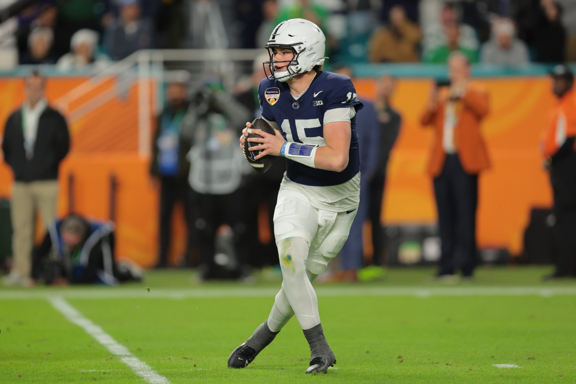 Penn State Nittany Lions quarterback Drew Allar (15) drops back to pass in the first half against the Notre Dame Fighting Irish in the Orange Bowl at Hard Rock Stadium.