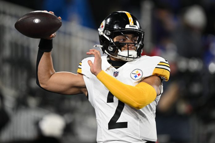 Pittsburgh Steelers quarterback Justin Fields (2) warms up before an AFC wild card game