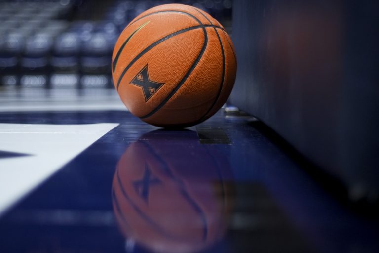 A view of the Xavier logo is seen on a basketball resting on the court during warmups before the game between the Villanova Wildcats and the Xavier Musketeers at the Cintas Center.