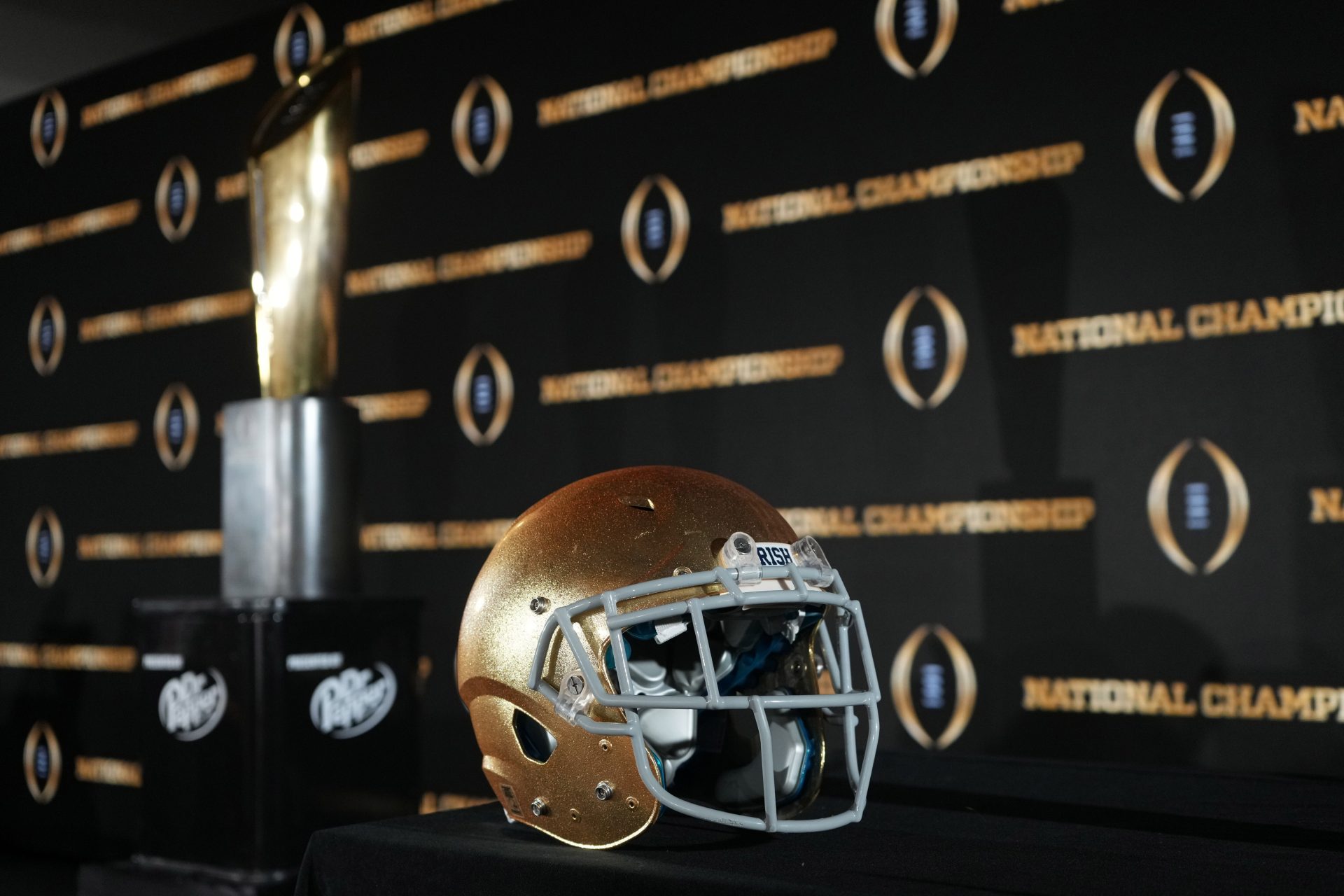 A Notre Dame Fighting Irish helmet and College Football Playoff National Championship trophy at press conference at The Westin Peachtree Plaza, Savannah Ballroom.