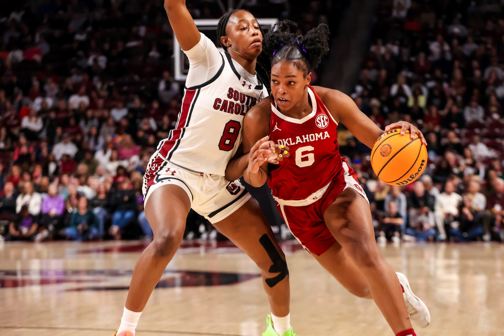 Oklahoma Sooners forward Sahara Williams (6) drives around South Carolina Gamecocks forward Joyce Edwards (8) in the second half at Colonial Life Arena.