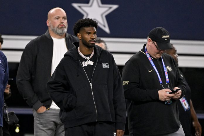 Shedeur Sanders of Colorado (2) looks on from the sidelines during the first half against the East