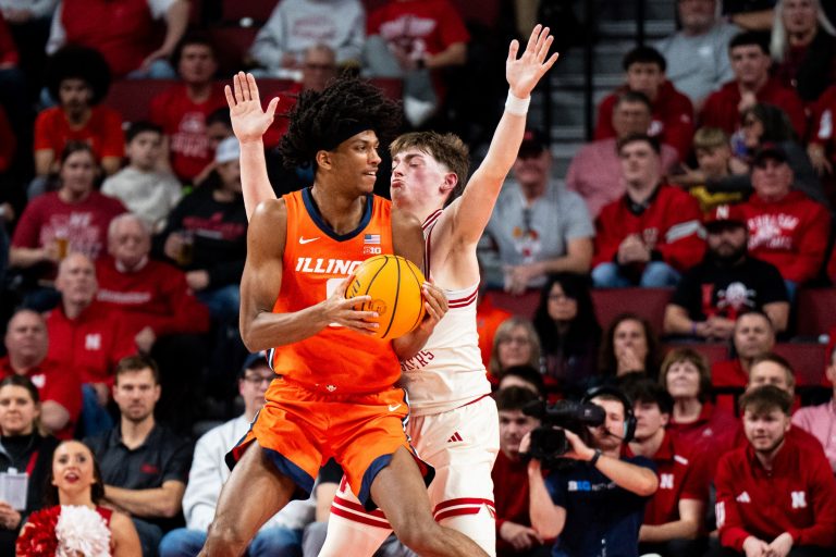 Illinois Fighting Illini forward Carey Booth (0) controls the ball against Nebraska Cornhuskers guard Connor Essegian (0) during the first half at Pinnacle Bank Arena.