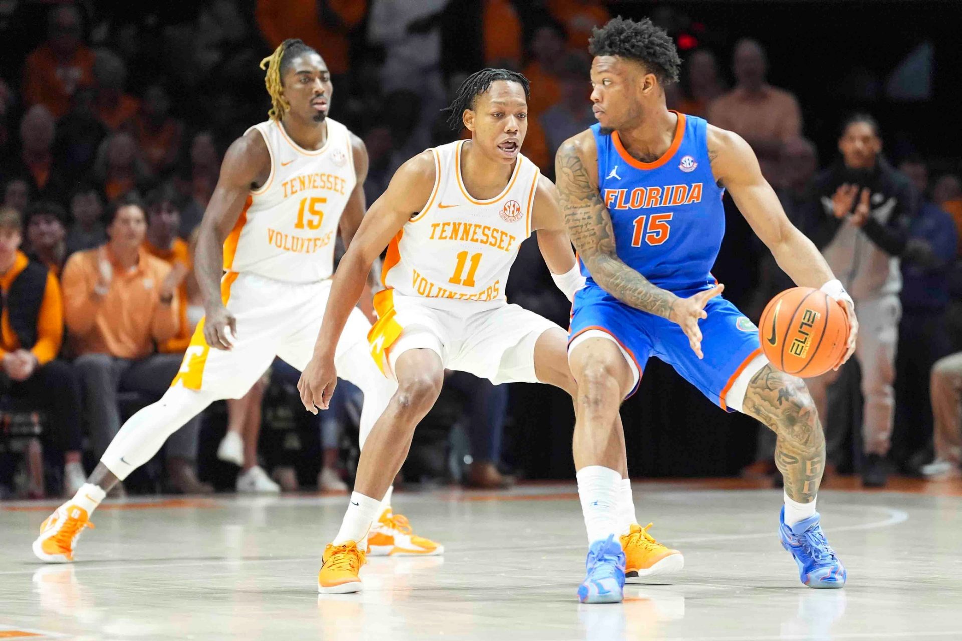 Florida's Alijah Martin (15) is defended by Tennessee's Jordan Gainey (11) during an NCAA college basketball game between Tennessee and Florida in Knoxville, Tenn., Saturday, Feb. 1, 2025.