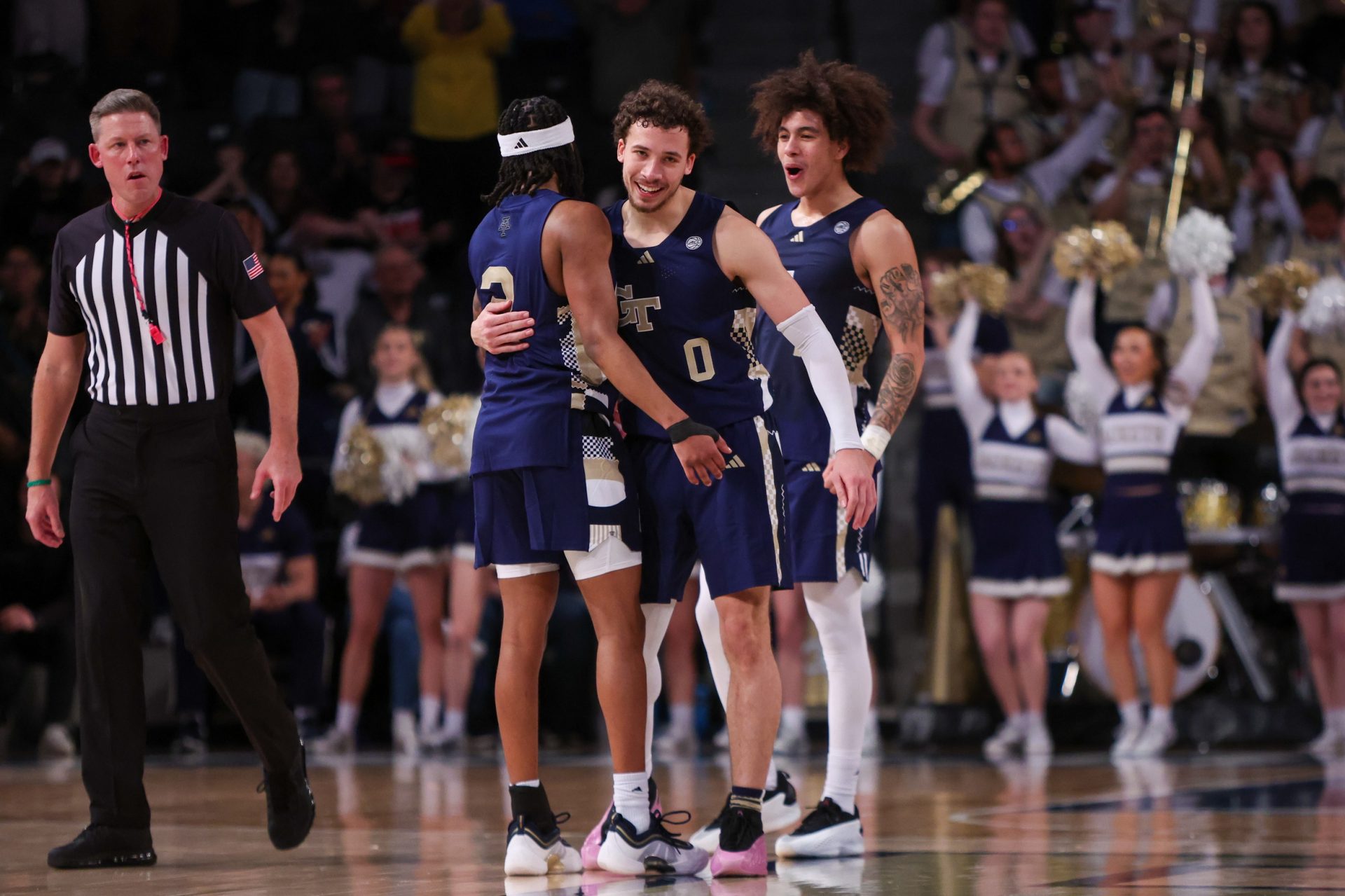 Georgia Tech Yellow Jackets guard Javian McCollum (2) and guard Lance Terry (0) and guard Naithan George (1) celebrate in the final seconds of a victory over the Louisville Cardinals at McCamish Pavilion.