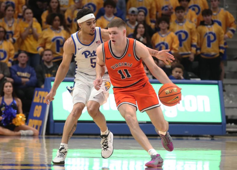 Virginia Cavaliers guard Isaac McKneely (11) dribbles the ball ahead of Pittsburgh Panthers guard Ishmael Leggett (5) during the second half at the Petersen Events Center.
