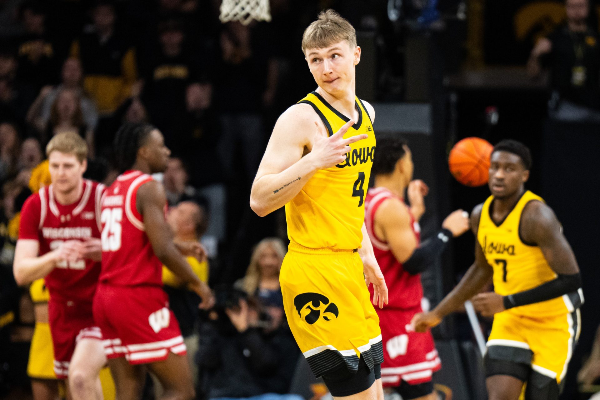 Iowa Hawkeyes guard Josh Dix (4) celebrates after a three-point basket against the Wisconsin Badgers at Carver-Hawkeye Arena.