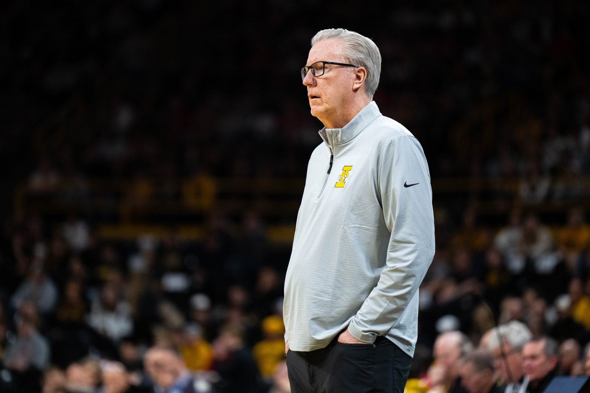 Iowa Hawkeyes head coach Fran McCaffrey watches from the bench during the first half against the Wisconsin Badgers at Carver-Hawkeye Arena.