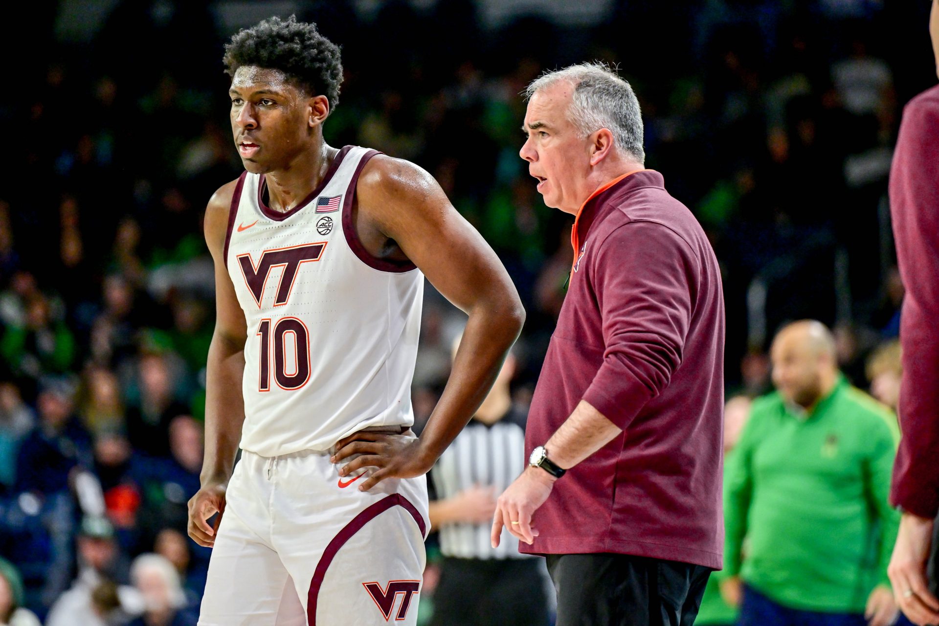 Virginia Tech Hokies head coach Mike Young talks to guard Tyler Johnson (10) in the second half against the Notre Dame Fighting Irish