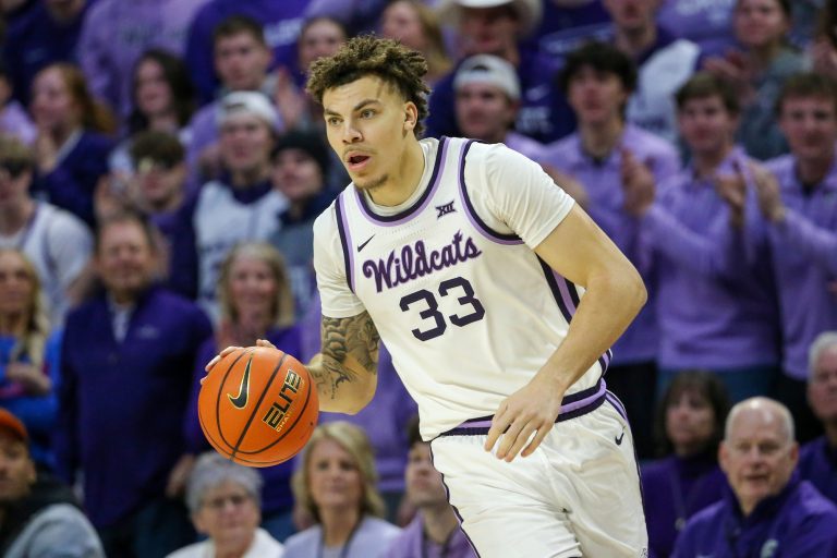 Kansas State Wildcats forward Coleman Hawkins (33) brings the ball up court during the first half against the Kansas Jayhawks at Bramlage Coliseum.