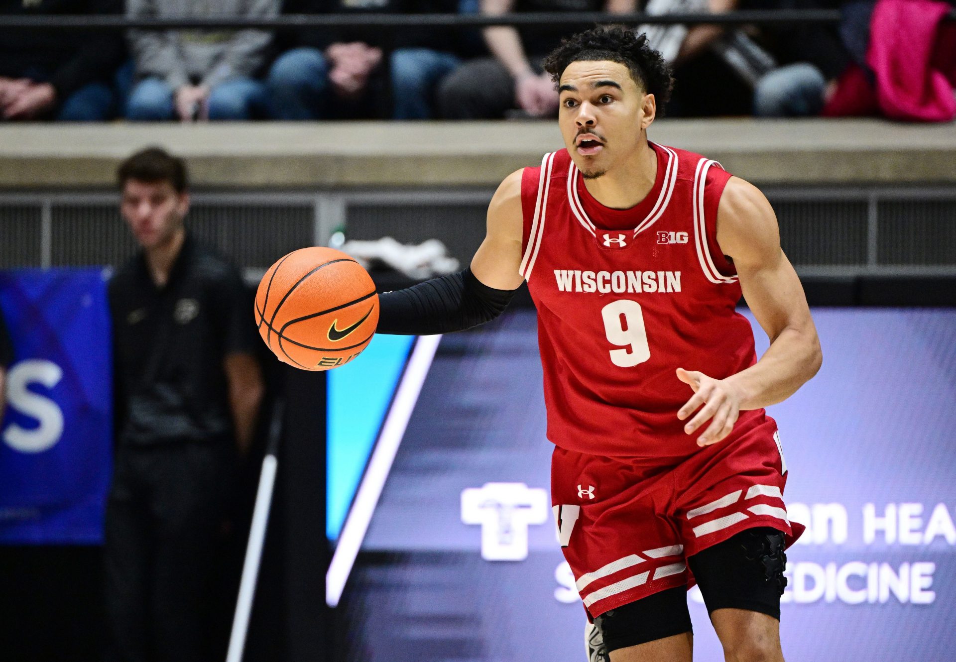 Wisconsin Badgers guard John Tonje (9) dribbles the ball down the court during the first half against the Purdue Boilermakers