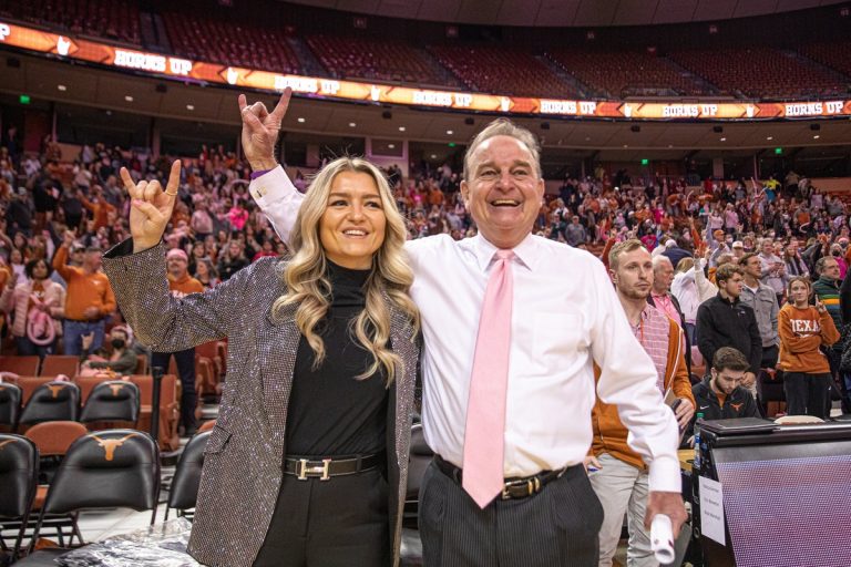 Texas head coach Vic Schaefer, right, and Blair Schaefer, left, celebrate a win over Oklahoma at the Frank Erwin Center on Feb. 12, 2022.