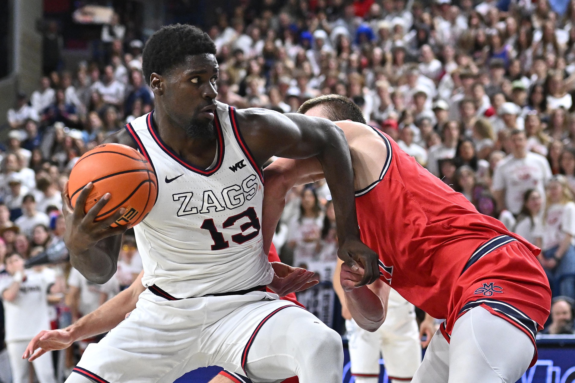 Gonzaga Bulldogs forward Graham Ike (13) is fouled on the shot by St. Mary's Gaels center Mitchell Saxen (11) in the second half