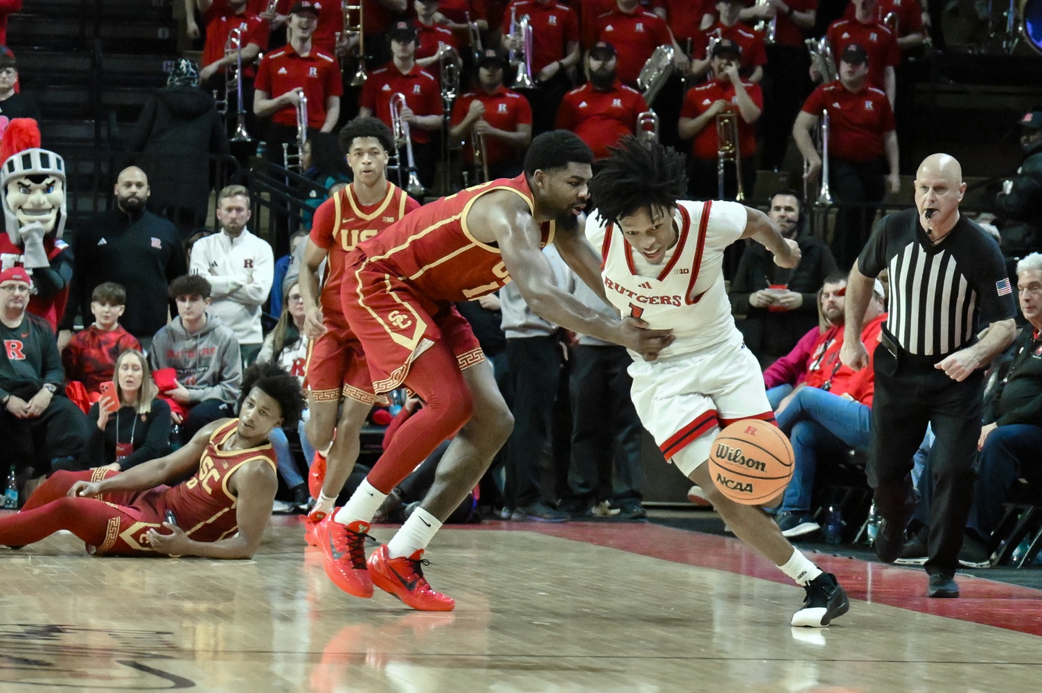 Rutgers Scarlet Knights guard Jamichael Davis (1) tries to get past USC Trojans forward Rashaun Agee (12) during the second half at Jersey Mike's Arena.