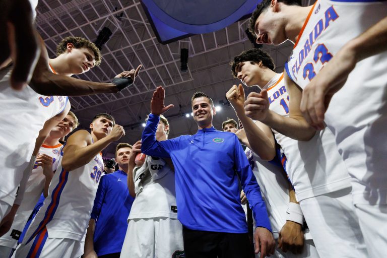 Florida Gators head coach Todd Golden smiles while huddling with his team after a game against the Oklahoma Sooners