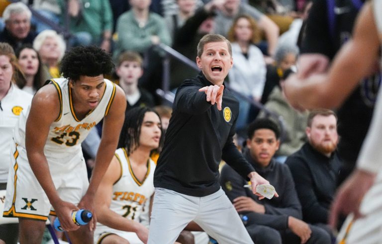 St. Xavier head coach Kevin Klein coaches his team during the game against Male at Male High School Thursday night in KHSAA Boys basketball 26th District Tournament in Louisville, Kentucky. Feb.27, 2025