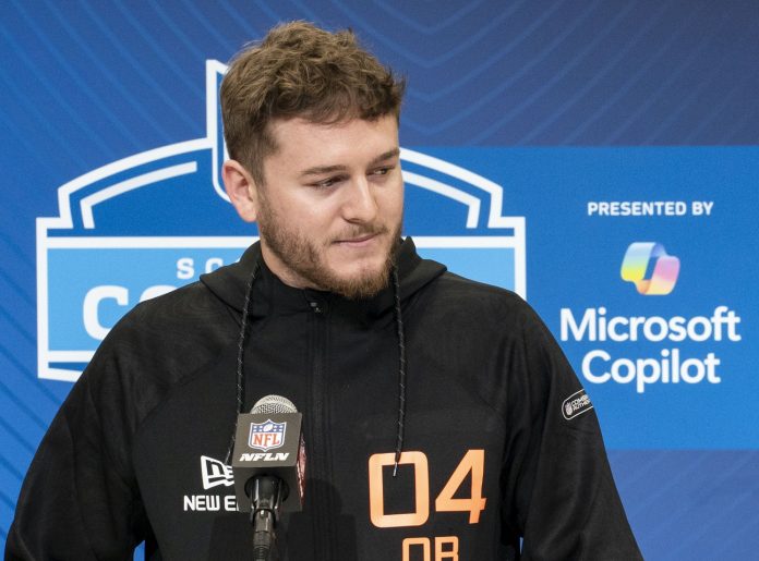 Texas quarterback Quinn Ewers (QB04) answers questions at a press conference during the 2025 NFL Combine