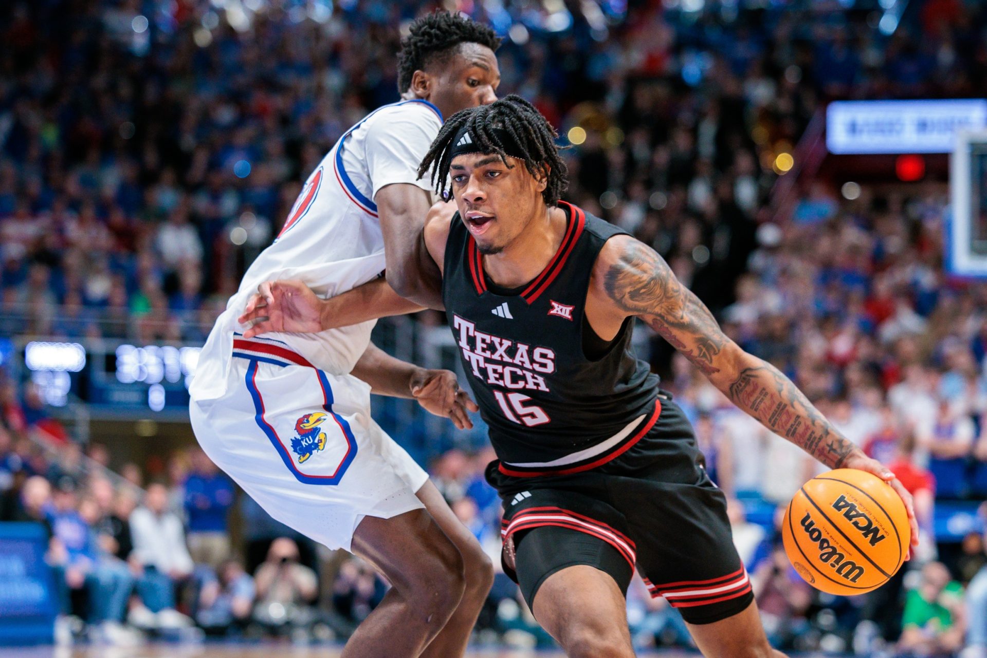 Texas Tech Red Raiders forward JT Toppin (15) drives to the basket during the first half against the Kansas Jayhawks at Allen Fieldhouse.