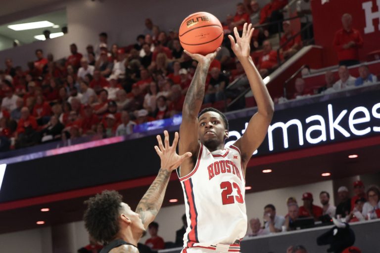 Houston Cougars guard Terrance Arceneaux (23) shoots against Cincinnati Bearcats guard Jizzle James (2) in the first half at Fertitta Center.
