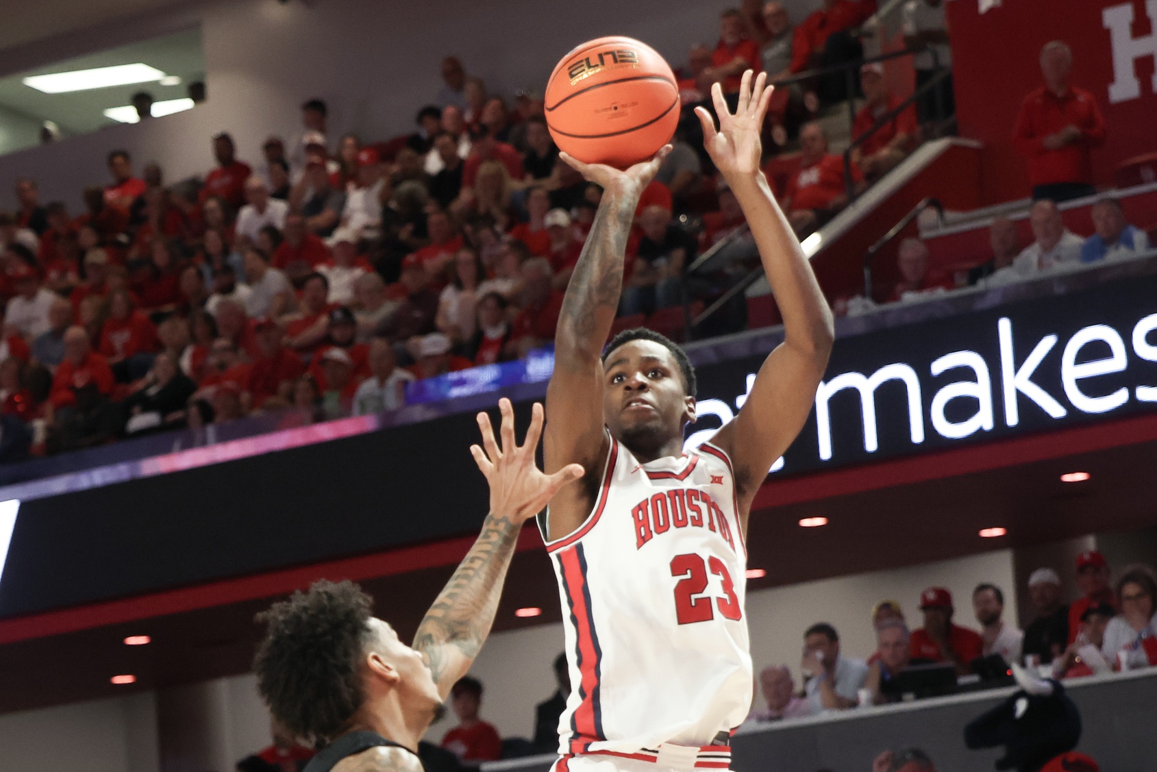 Houston Cougars guard Terrance Arceneaux (23) shoots against Cincinnati Bearcats guard Jizzle James (2) in the first half at Fertitta Center.