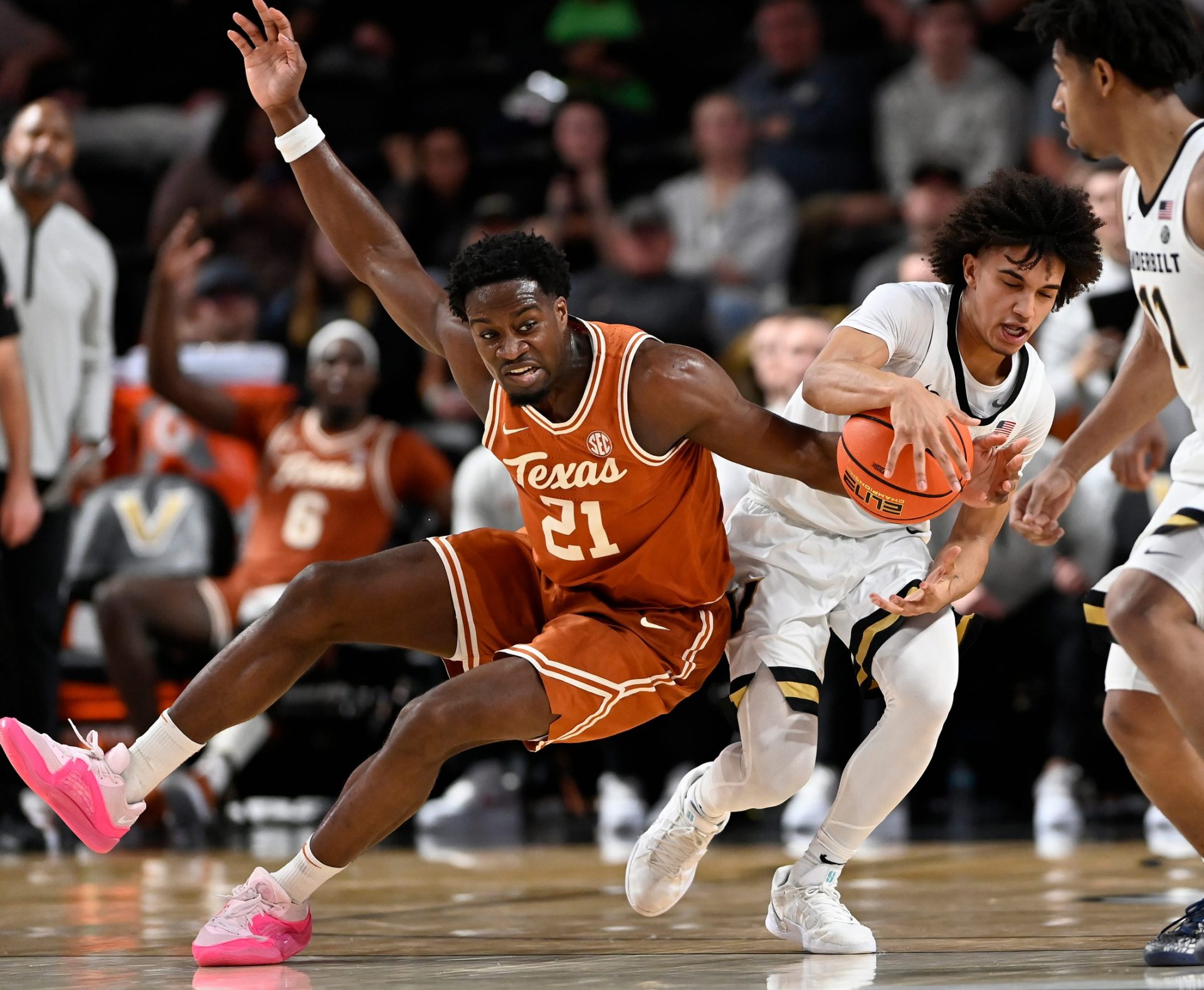 Texas forward Ze'Rik Onyema (21) fouls Vanderbilt guard Tyler Tanner (3) during an NCAA college basketball game Saturday, Feb. 8, 2025, in Nashville, Tenn.