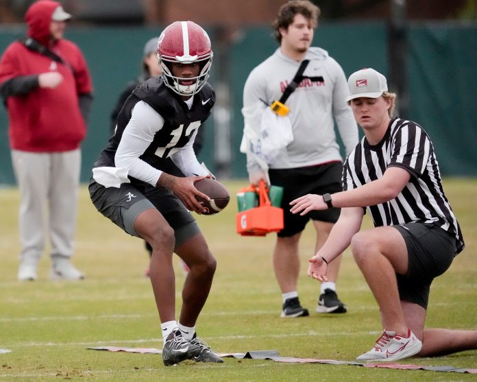 Quarterback Keelon Russell (12) works a drill during Spring Practice for the Crimson Tide.