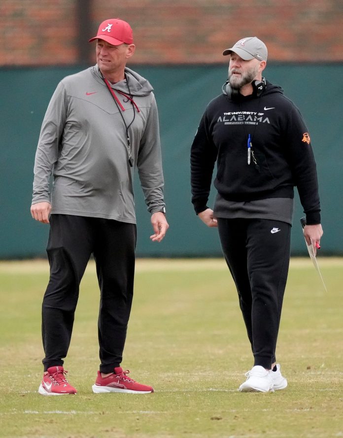 Head coach Kalen DeBoer and Offensive Coordinator Ryan Grubb watch the offense work during Spring Practice for the Crimson Tide.